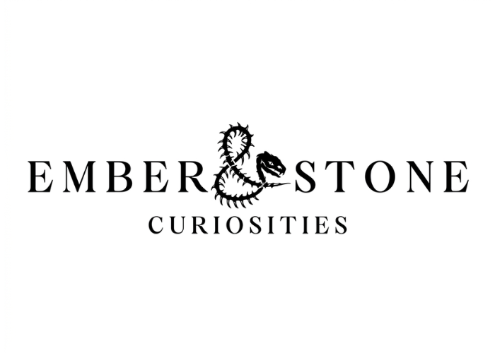 Logo of Ember & Stone Curiosities with a stylized dragon design on a white background